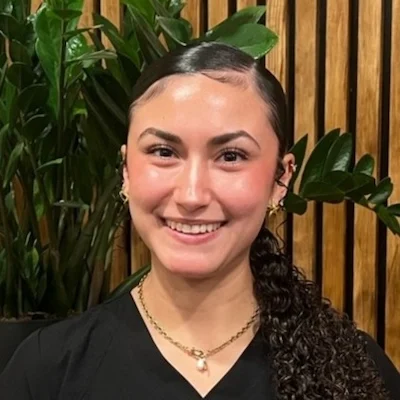Headshot of Ariana smiling in the Integrated Health Solutions office