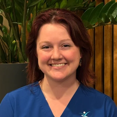 Headshot of Chrissy smiling in the Integrated Health Solutions office