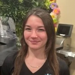 Headshot of Maddie smiling in the Integrated Health Solutions office