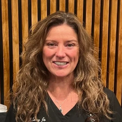 Headshot of Mary Jo smiling in the Integrated Health Solutions office